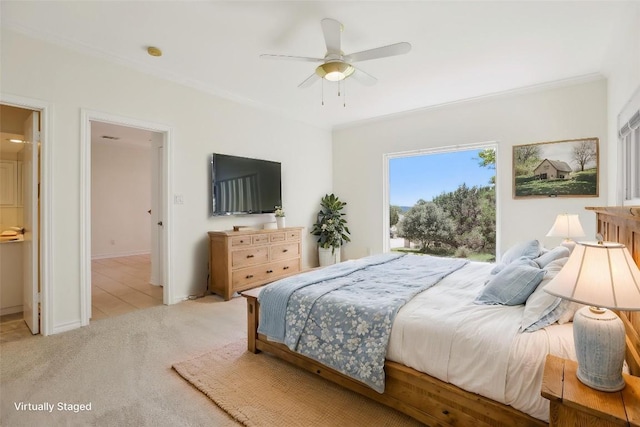 carpeted bedroom featuring crown molding, ceiling fan, and baseboards