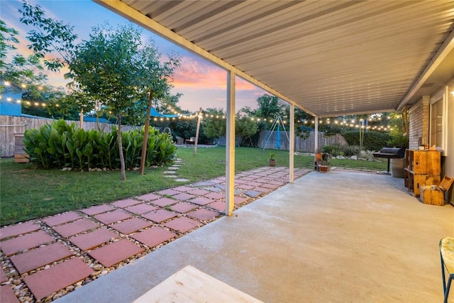 view of patio terrace at dusk