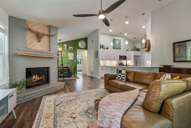 8304 Avocet Dr, Austin, TX 78745 - living area with a brick fireplace, dark wood-style floors, a ceiling fan, and high vaulted ceiling