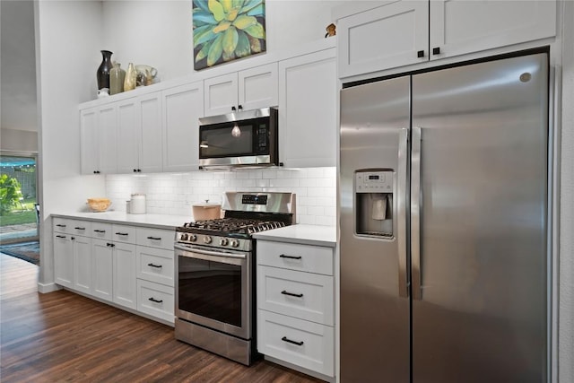 8304 Avocet Dr, Austin, TX 78745 - kitchen featuring stainless steel appliances, light countertops, backsplash, and dark wood-type flooring