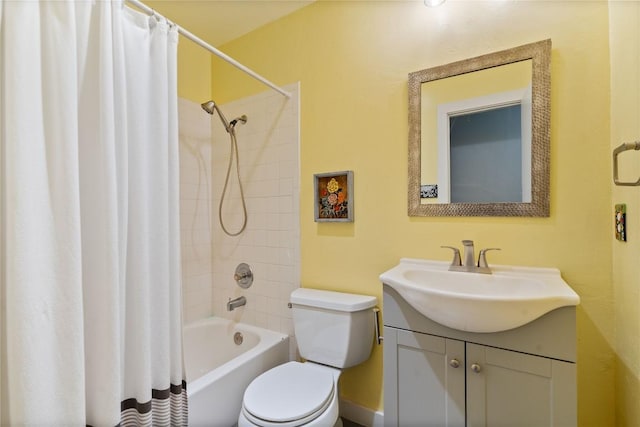 full bath with toilet, vanity, and shower / bath combo with shower curtain