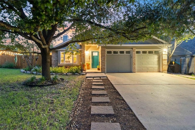 8304 Avocet Dr, Austin, TX 78745 - view of front of property featuring a garage and concrete driveway