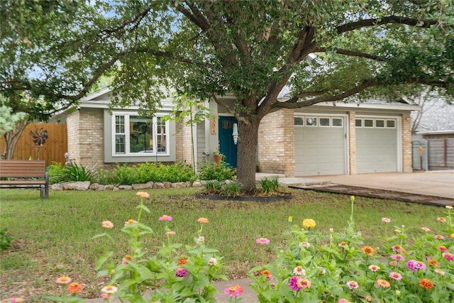8304 Avocet Dr, Austin, TX 78745 - view of front of property with brick siding and concrete driveway