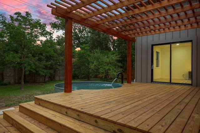 1811 Rogge Ln, Austin, TX 78723 - deck at dusk with a fenced backyard, an outdoor pool, and a pergola