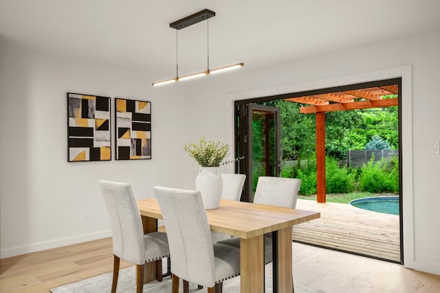 1811 Rogge Ln, Austin, TX 78723 - dining space with light wood-style flooring and baseboards