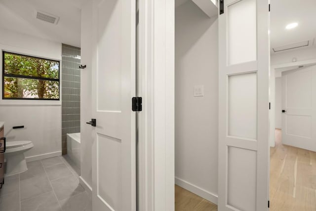 1811 Rogge Ln, Austin, TX 78723 - bathroom featuring toilet, bathtub / shower combination, vanity, and baseboards