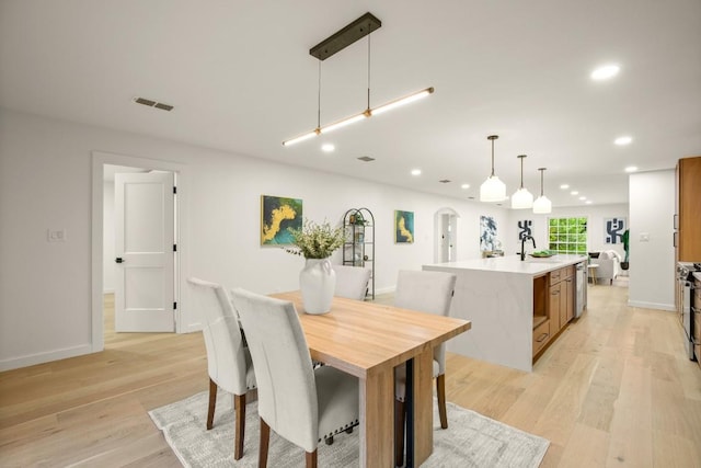 1811 Rogge Ln, Austin, TX 78723 - dining room featuring recessed lighting, light wood-style flooring, and baseboards