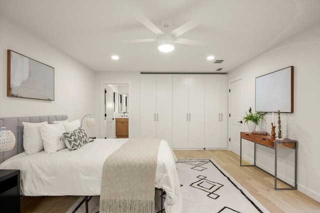 1811 Rogge Ln, Austin, TX 78723 - bedroom featuring light wood finished floors, recessed lighting, connected bathroom, baseboards, and a ceiling fan