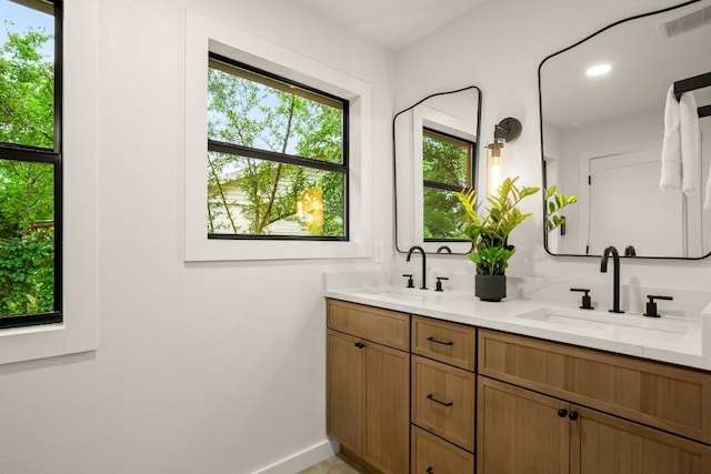 1811 Rogge Ln, Austin, TX 78723 - full bathroom with double vanity and baseboards