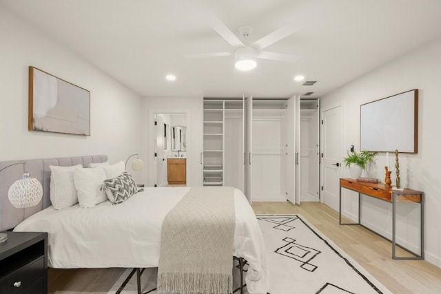 1811 Rogge Ln, Austin, TX 78723 - bedroom featuring light wood-type flooring, recessed lighting, ensuite bathroom, baseboards, and a ceiling fan