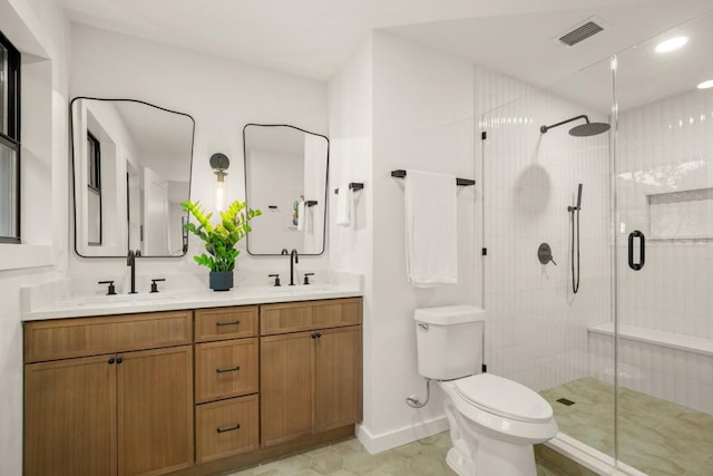 1811 Rogge Ln, Austin, TX 78723 - bathroom featuring a shower stall, toilet, double vanity, baseboards, and recessed lighting