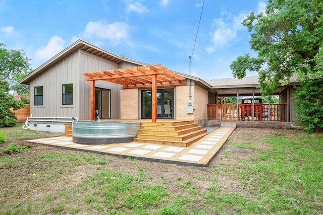 1811 Rogge Ln, Austin, TX 78723 - back of property with a pergola, a wooden deck, and board and batten siding