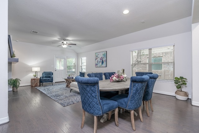 212 Beretta Cir, Georgetown, TX 78628 - dining room featuring a ceiling fan, baseboards, dark wood-style flooring, and a textured ceiling