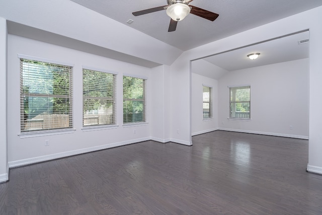 212 Beretta Cir, Georgetown, TX 78628 - spare room with a ceiling fan, lofted ceiling, dark wood-style flooring, and baseboards