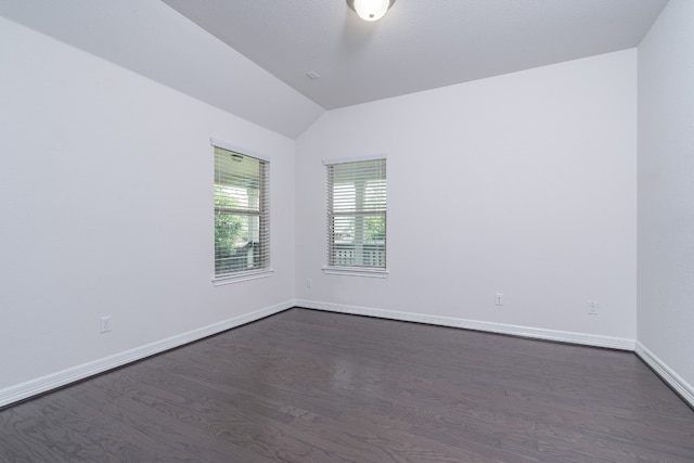 212 Beretta Cir, Georgetown, TX 78628 - empty room with dark wood finished floors, lofted ceiling, and baseboards