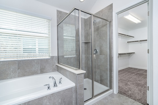 212 Beretta Cir, Georgetown, TX 78628 - full bathroom with a stall shower, a walk in closet, a garden tub, and tile patterned flooring