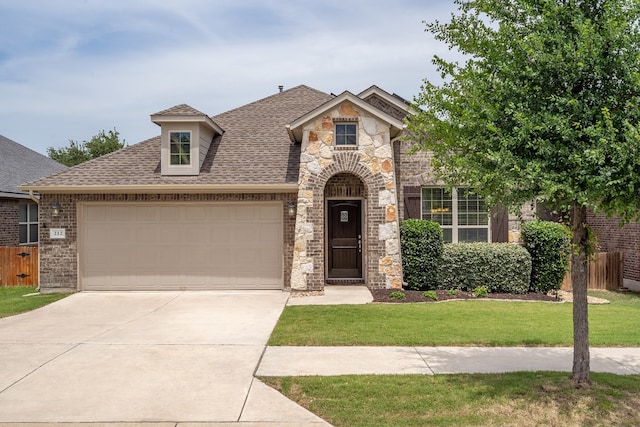 212 Beretta Cir, Georgetown, TX 78628 - french country home featuring a shingled roof, concrete driveway, an attached garage, stone siding, and brick siding