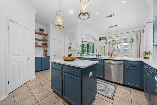 kitchen with dishwasher, blue cabinetry, a sink, light tile patterned floors, and crown molding