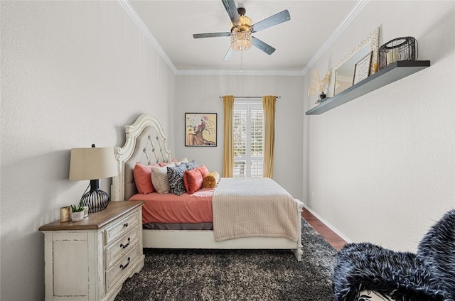 bedroom featuring ornamental molding, a ceiling fan, dark wood-style flooring, and baseboards