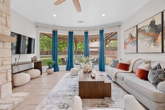 tiled living room with crown molding, recessed lighting, and ceiling fan