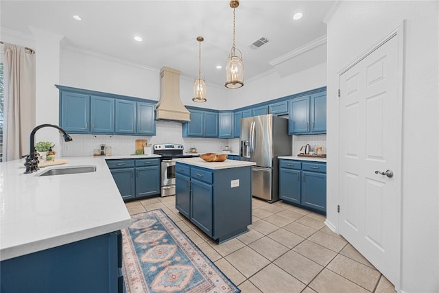 kitchen featuring appliances with stainless steel finishes, a sink, custom exhaust hood, blue cabinets, and crown molding
