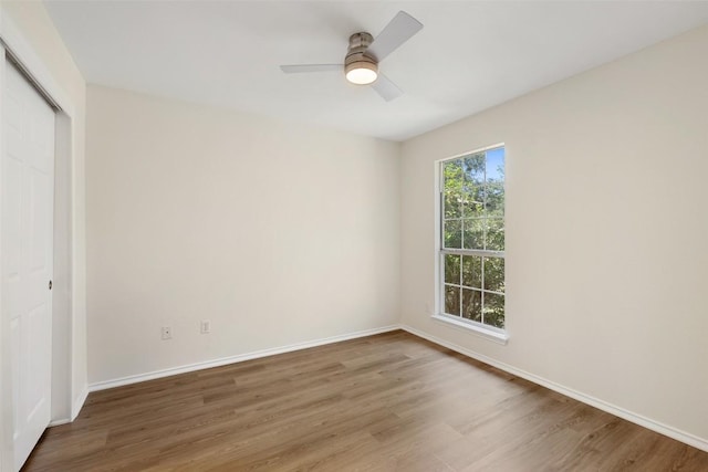 3306 Grasshopper Dr, Austin, TX 78748 - unfurnished bedroom featuring wood finished floors, a closet, baseboards, and ceiling fan