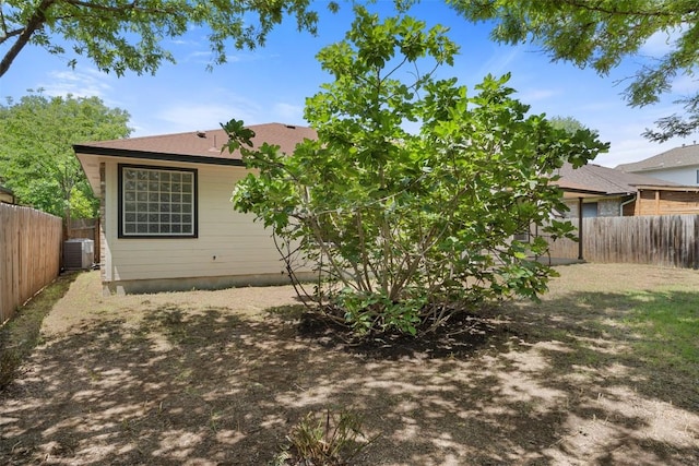 3306 Grasshopper Dr, Austin, TX 78748 - rear view of house with central AC unit and a fenced backyard