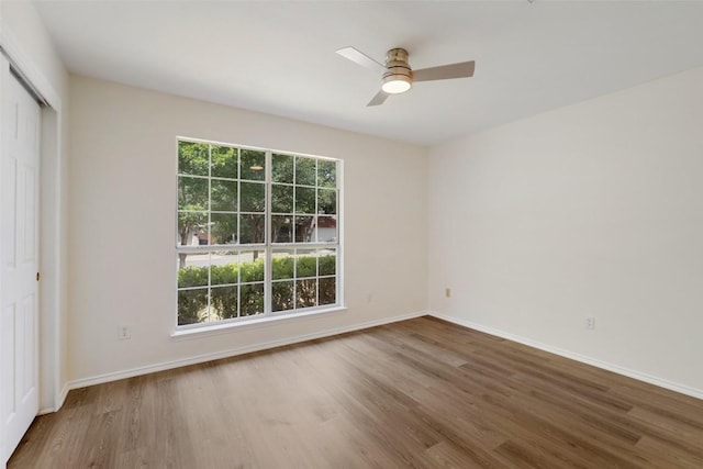3306 Grasshopper Dr, Austin, TX 78748 - unfurnished bedroom with wood finished floors, a closet, and baseboards