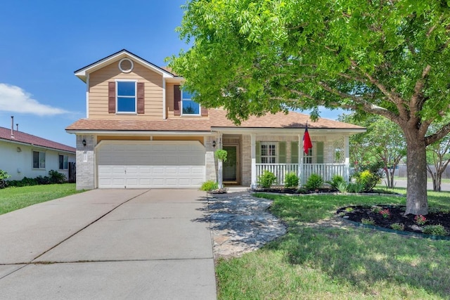 127 Edison Dr, Hutto, TX 78634 - traditional-style home with a garage, a porch, concrete driveway, a front lawn, and brick siding