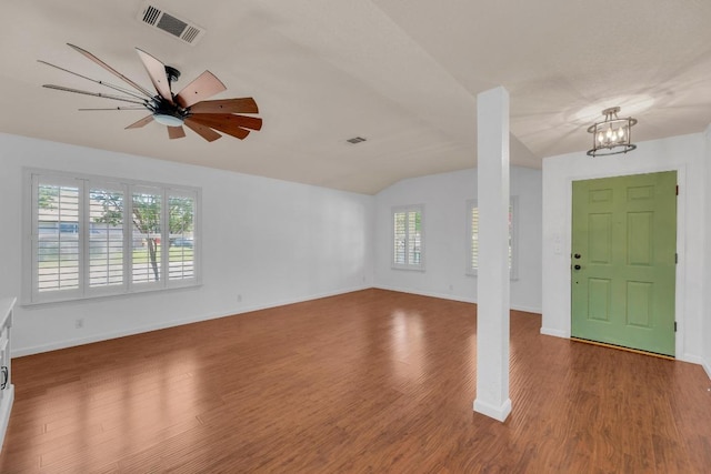 127 Edison Dr, Hutto, TX 78634 - foyer entrance featuring lofted ceiling, wood finished floors, a ceiling fan, a chandelier, and baseboards