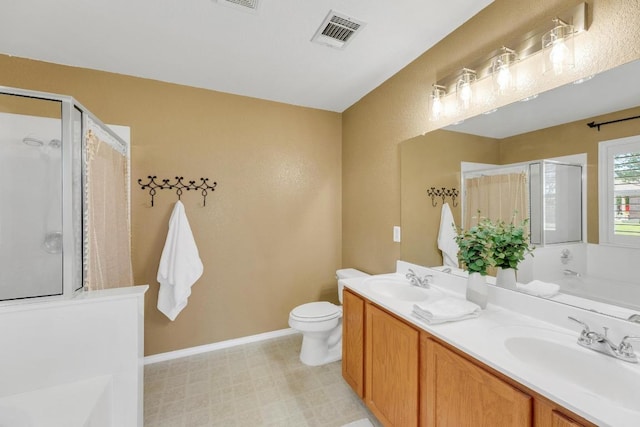 127 Edison Dr, Hutto, TX 78634 - bathroom featuring double vanity, a stall shower, a garden tub, and toilet
