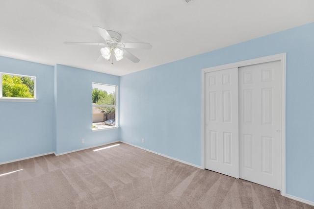 127 Edison Dr, Hutto, TX 78634 - unfurnished bedroom with a closet, carpet flooring, baseboards, and ceiling fan