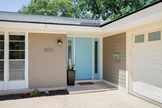 1805 Westmoor Dr, Austin, TX 78723 - property entrance with brick siding and roof with shingles