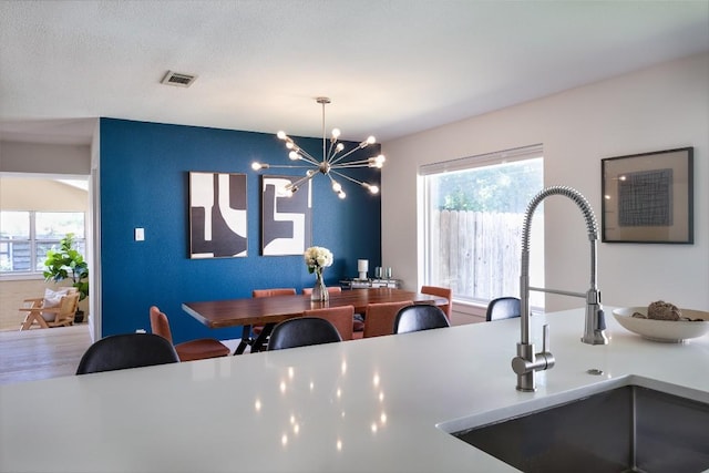 1805 Westmoor Dr, Austin, TX 78723 - dining space with plenty of natural light and a chandelier