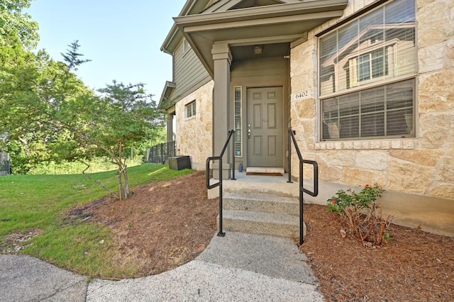 3101 Davis Ln Unit 6402, Austin, TX 78748 - entrance to property with stone siding and a lawn