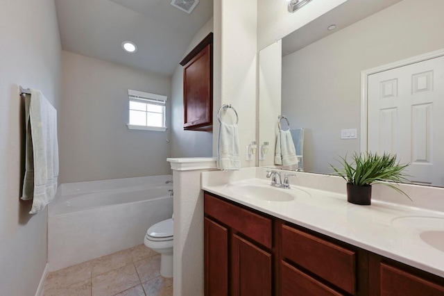 3101 Davis Ln Unit 6402, Austin, TX 78748 - full bathroom featuring toilet, a garden tub, double vanity, and tile patterned floors