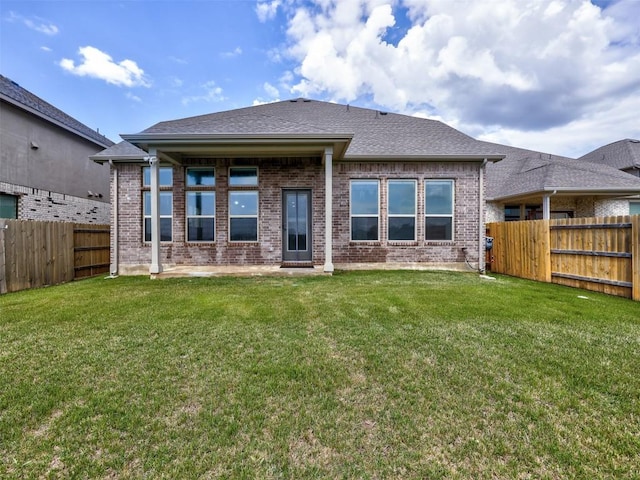 617 Silent Creek Cv, Georgetown, TX 78628 - back of property featuring brick siding and roof with shingles
