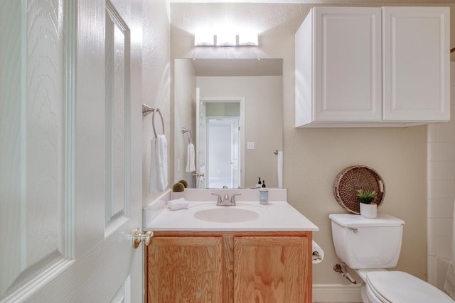 bathroom with toilet and vanity