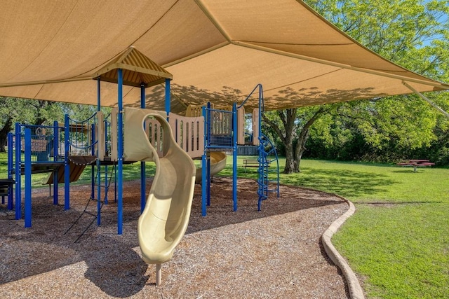community playground featuring a lawn