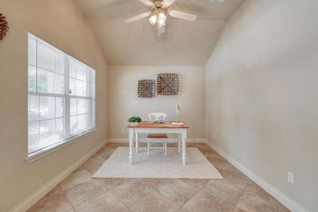 tiled home office featuring lofted ceiling, a ceiling fan, and baseboards
