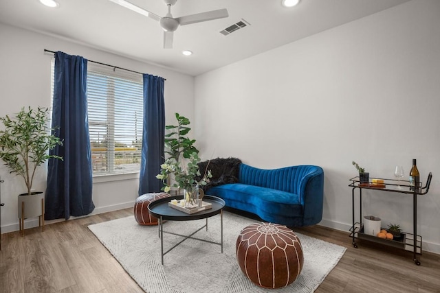 6324 N Lamar Blvd Unit 212, Austin, TX 78752 - living area with wood finished floors, baseboards, recessed lighting, and a ceiling fan