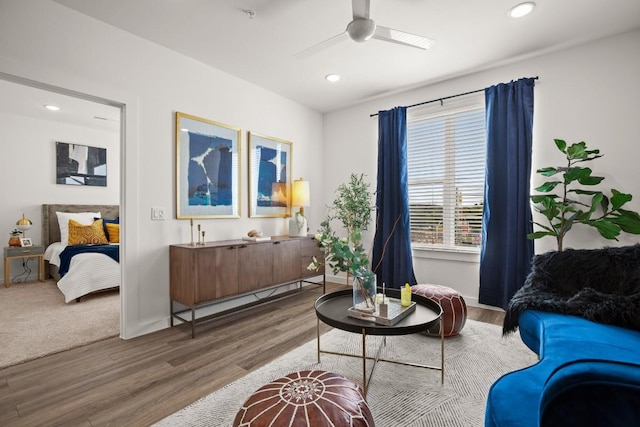 6324 N Lamar Blvd Unit 212, Austin, TX 78752 - sitting room featuring a ceiling fan, wood finished floors, recessed lighting, and baseboards