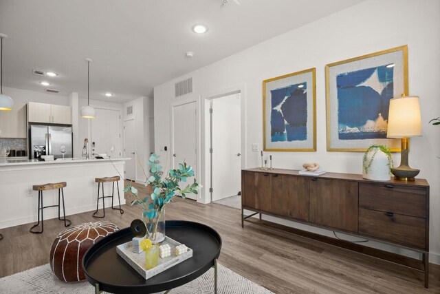 6324 N Lamar Blvd Unit 212, Austin, TX 78752 - living area featuring light wood-type flooring and recessed lighting