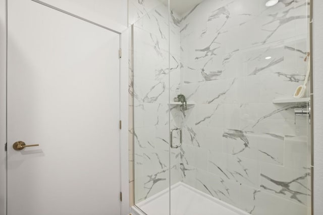 6324 N Lamar Blvd Unit 212, Austin, TX 78752 - bathroom with a marble finish shower
