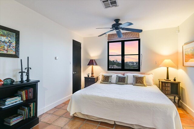 698 Windsong Trl, West Lake Hills, TX 78746 - bedroom with baseboards, ceiling fan, and light tile patterned floors
