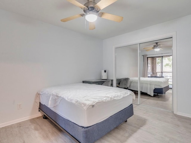 421 W San Antonio St Unit F1, San Marcos, TX 78666 - bedroom featuring light wood-type flooring, baseboards, a closet, and ceiling fan
