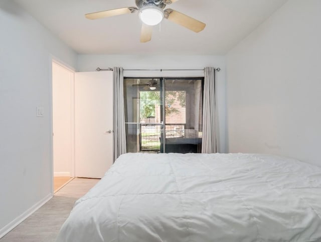 421 W San Antonio St Unit F1, San Marcos, TX 78666 - bedroom with wood finished floors, access to outside, baseboards, and a ceiling fan