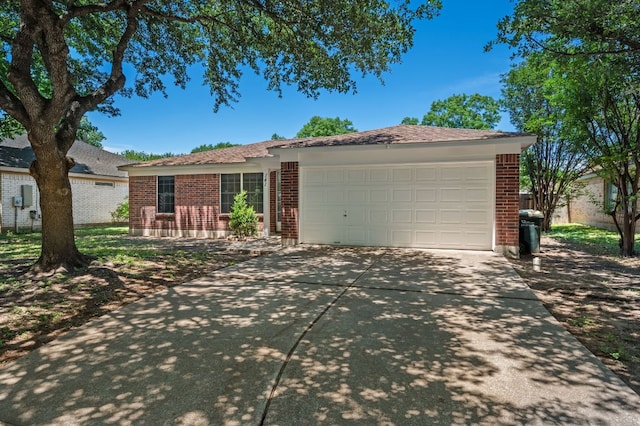 141 Britni Loop, Kyle, TX 78640 - single story home with brick siding, concrete driveway, and a garage