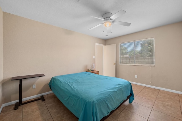 141 Britni Loop, Kyle, TX 78640 - tiled bedroom with baseboards and ceiling fan