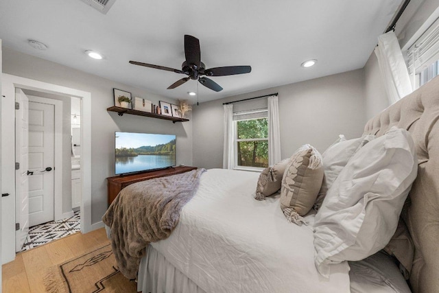 1302 Astor Pl, Austin, TX 78721 - bedroom with wood finished floors, recessed lighting, ceiling fan, and ensuite bathroom